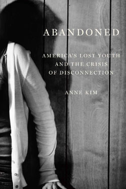 book cover depicts a young person against a wall with their face out of view and a long shadow in black and white